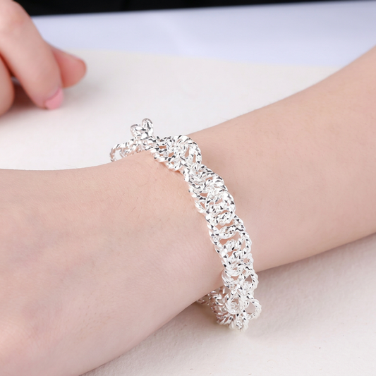 Bracelet on wrist with background text removed