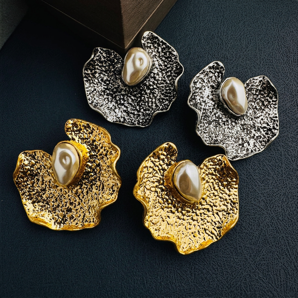 Mixed gold and silver earrings with text removed