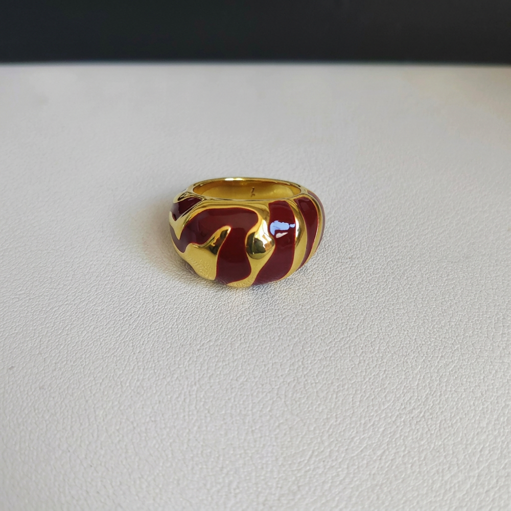 Red and gold ring with background name removed
