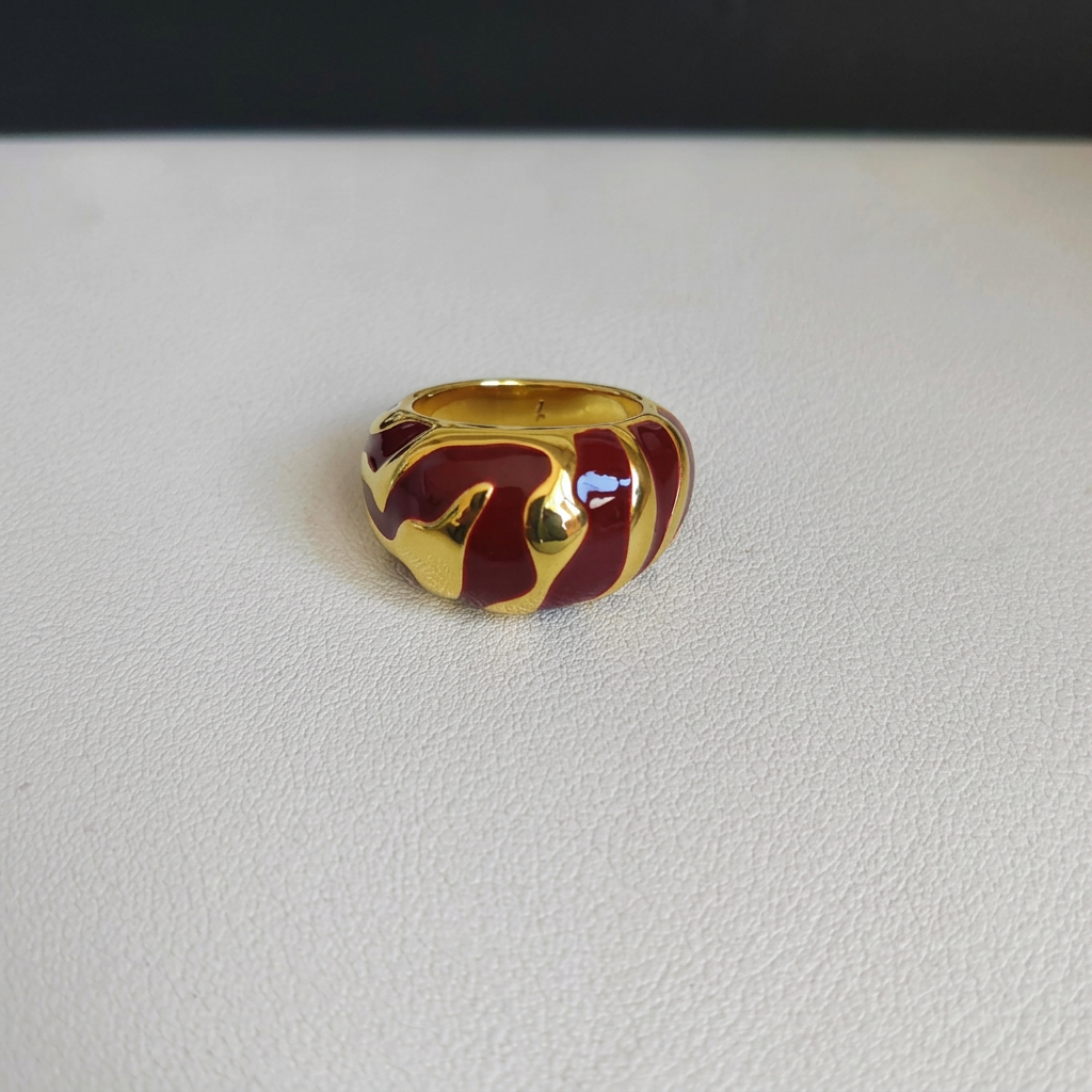 Red and gold ring with background name removed