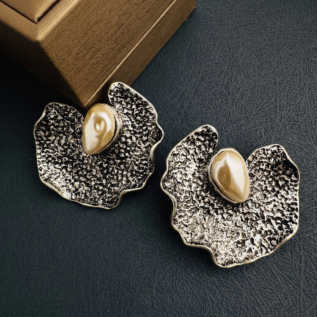 Silver earrings with text removed