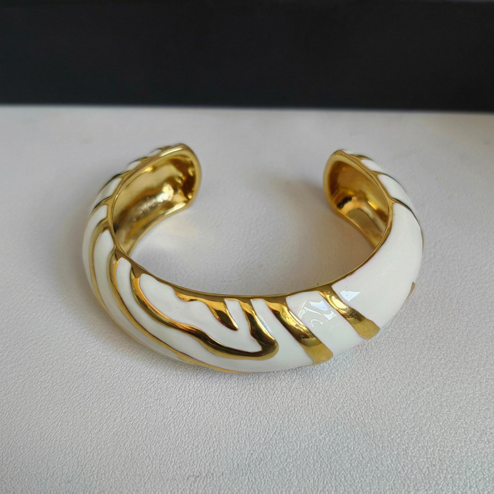 White bracelet with background name removed