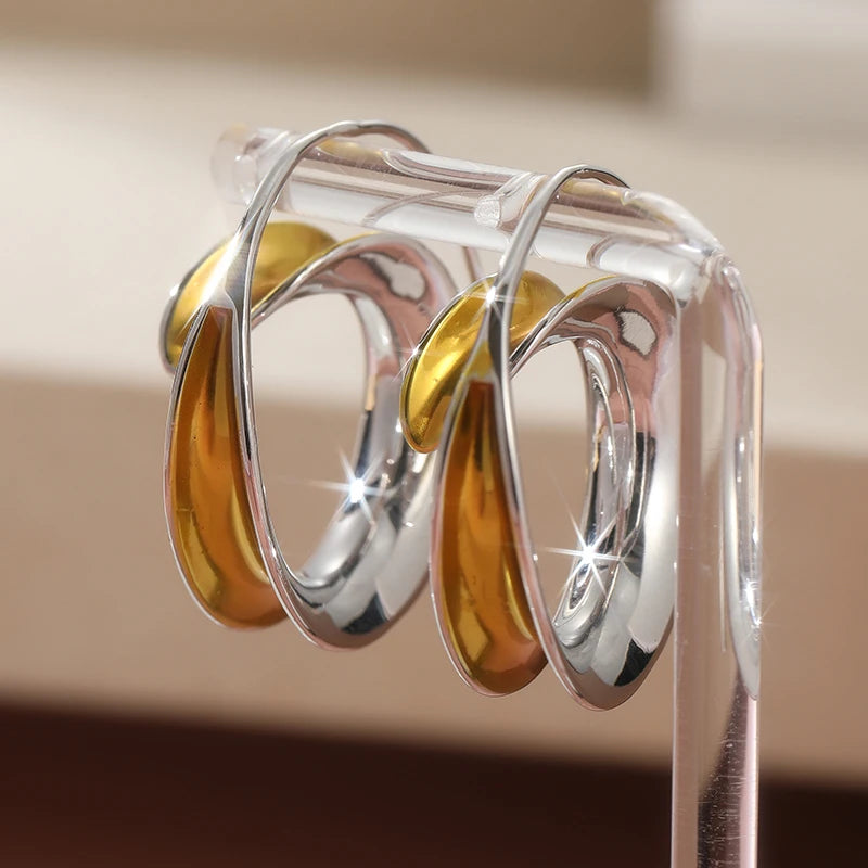 Simple Fashion Two Tone Metal Geometric Glossy Surface Hoop Earrings.
