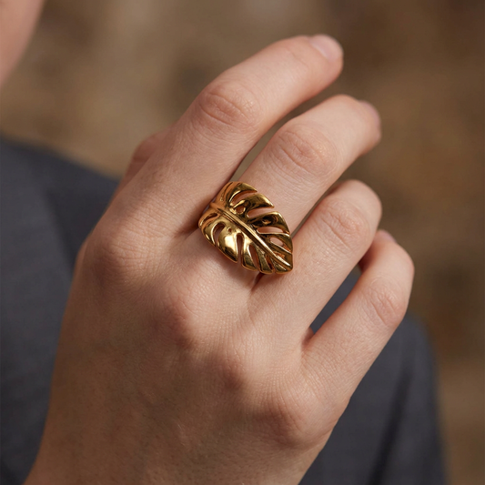 Close-up focused on the gold leaf ring with the face removed