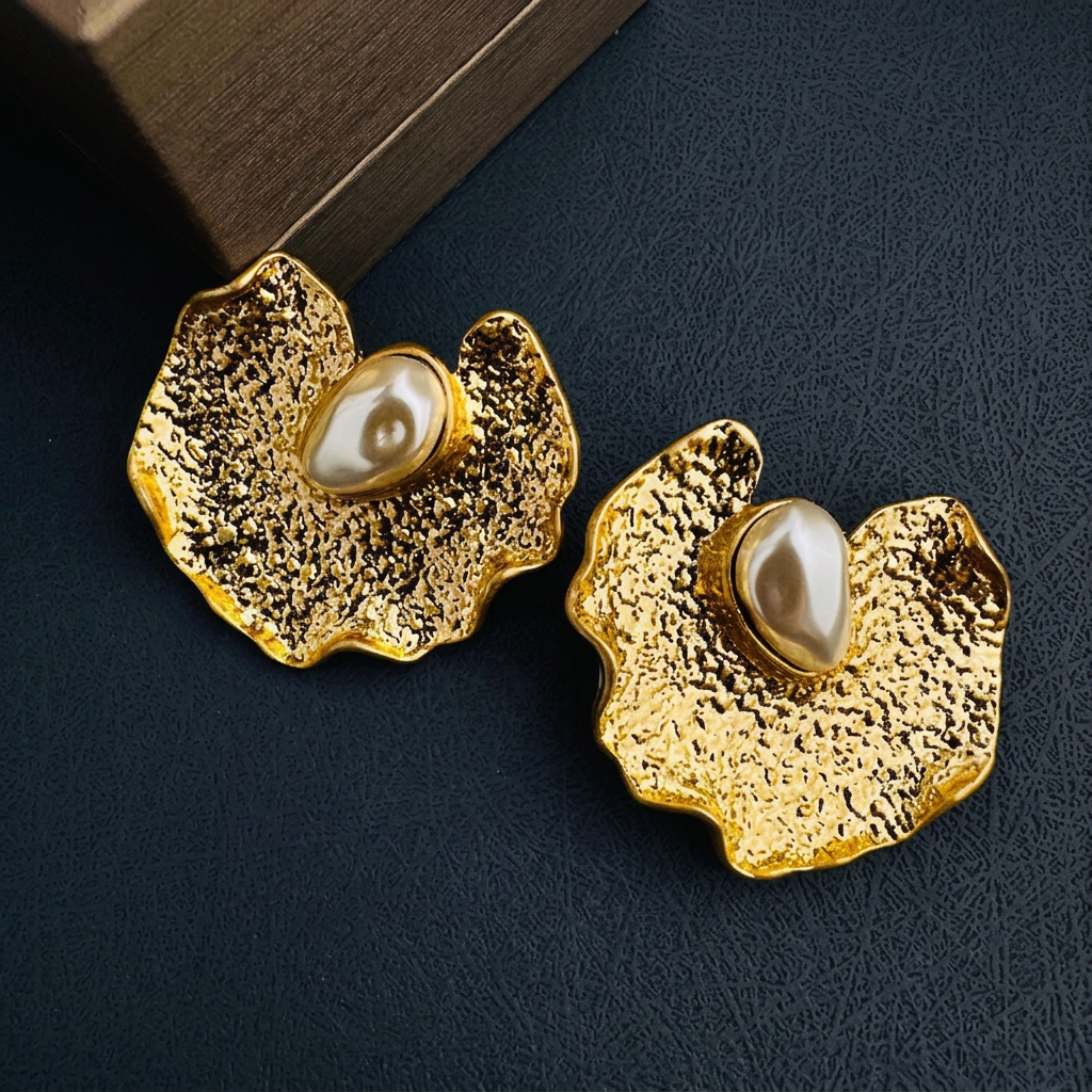 Gold earrings with text removed