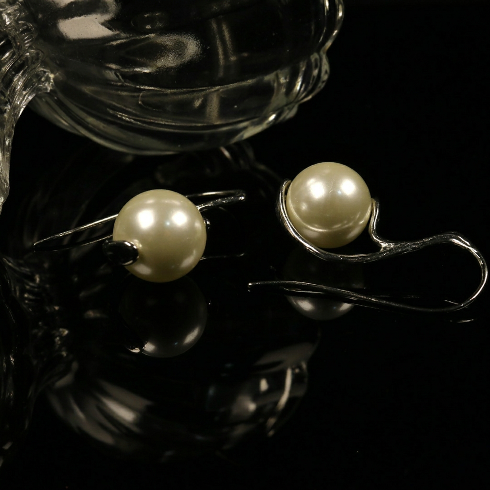 Pearl earrings photo with text removed