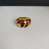 Red and gold ring with background name removed