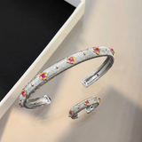 Silver bracelet and ring, text-removal edit
