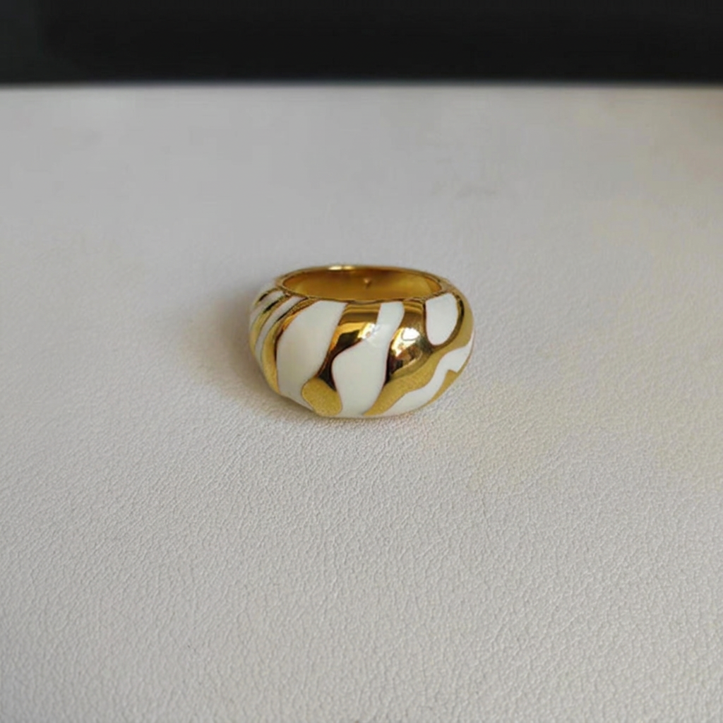 White and gold ring with background name removed