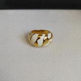 White and gold ring with background name removed